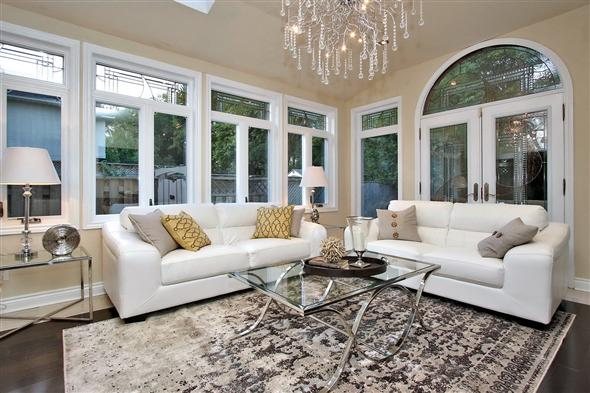 Inside a finished WDC job: bright living room with new windows, garden doors and a chandelier