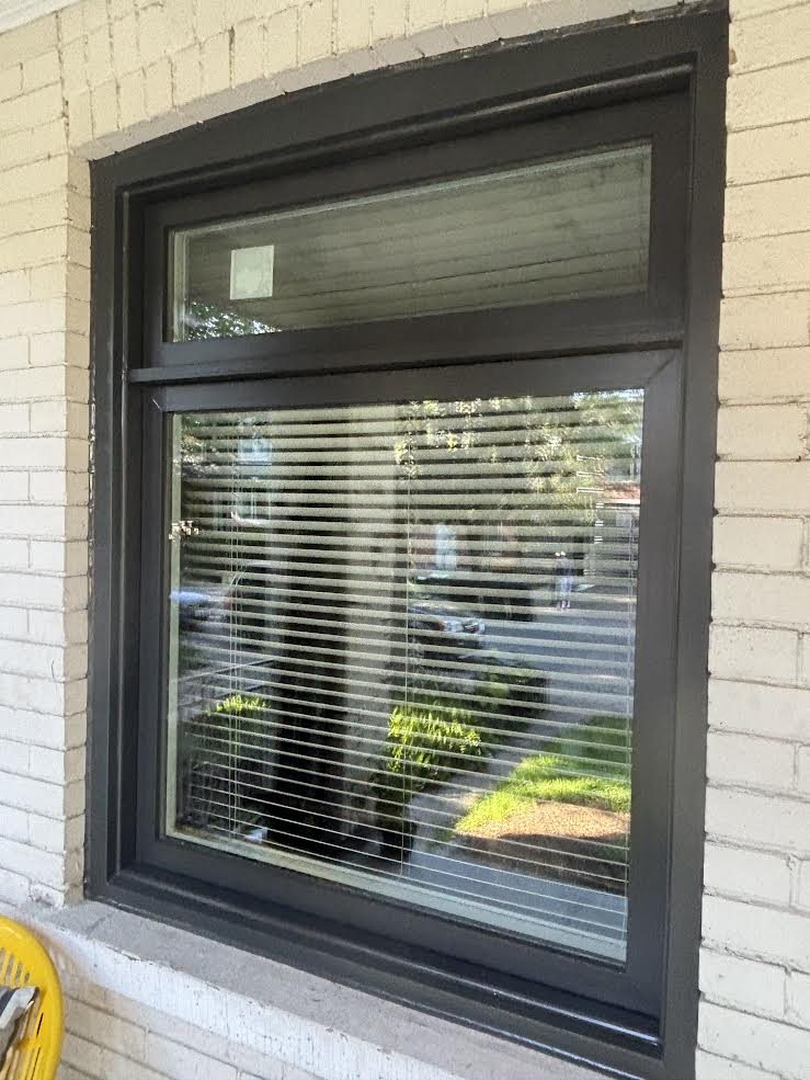 Real WDC project: close-up of a black vinyl window frame and sash